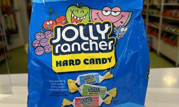 Packet of Jolly Ranchers at window.