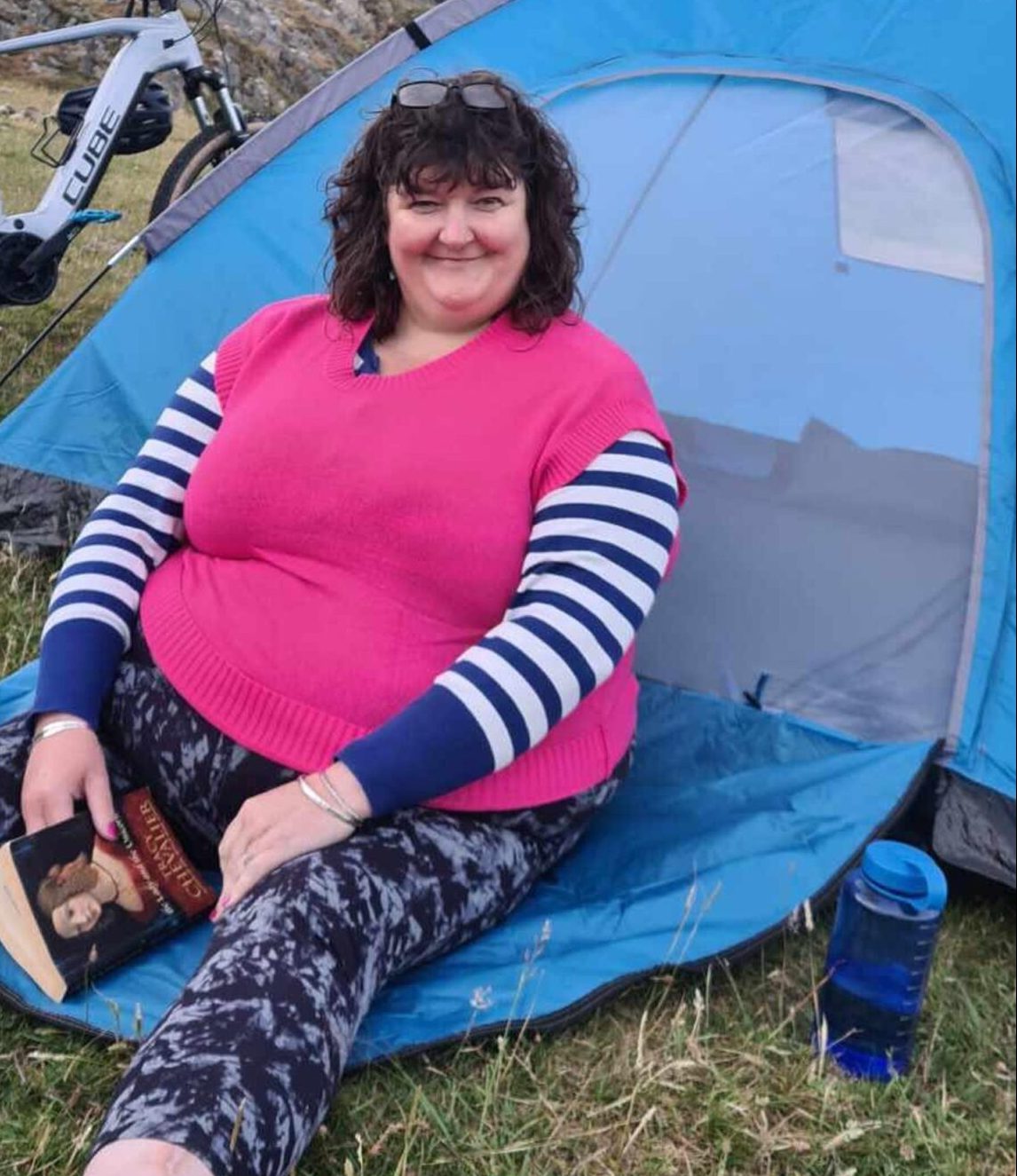 Louise Glen outside a tent.