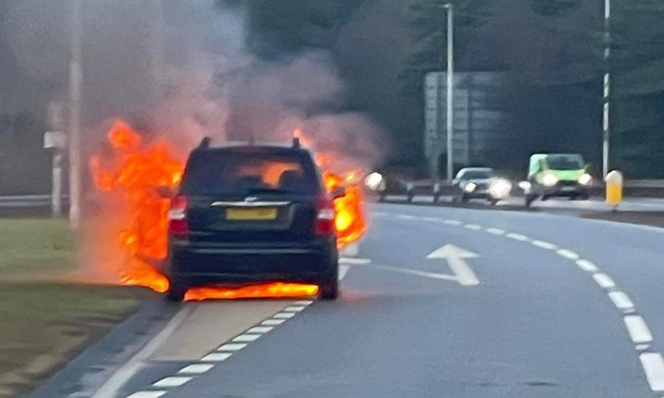 The car exploded into flames on the side of the A9 by the Munlochy Junction.