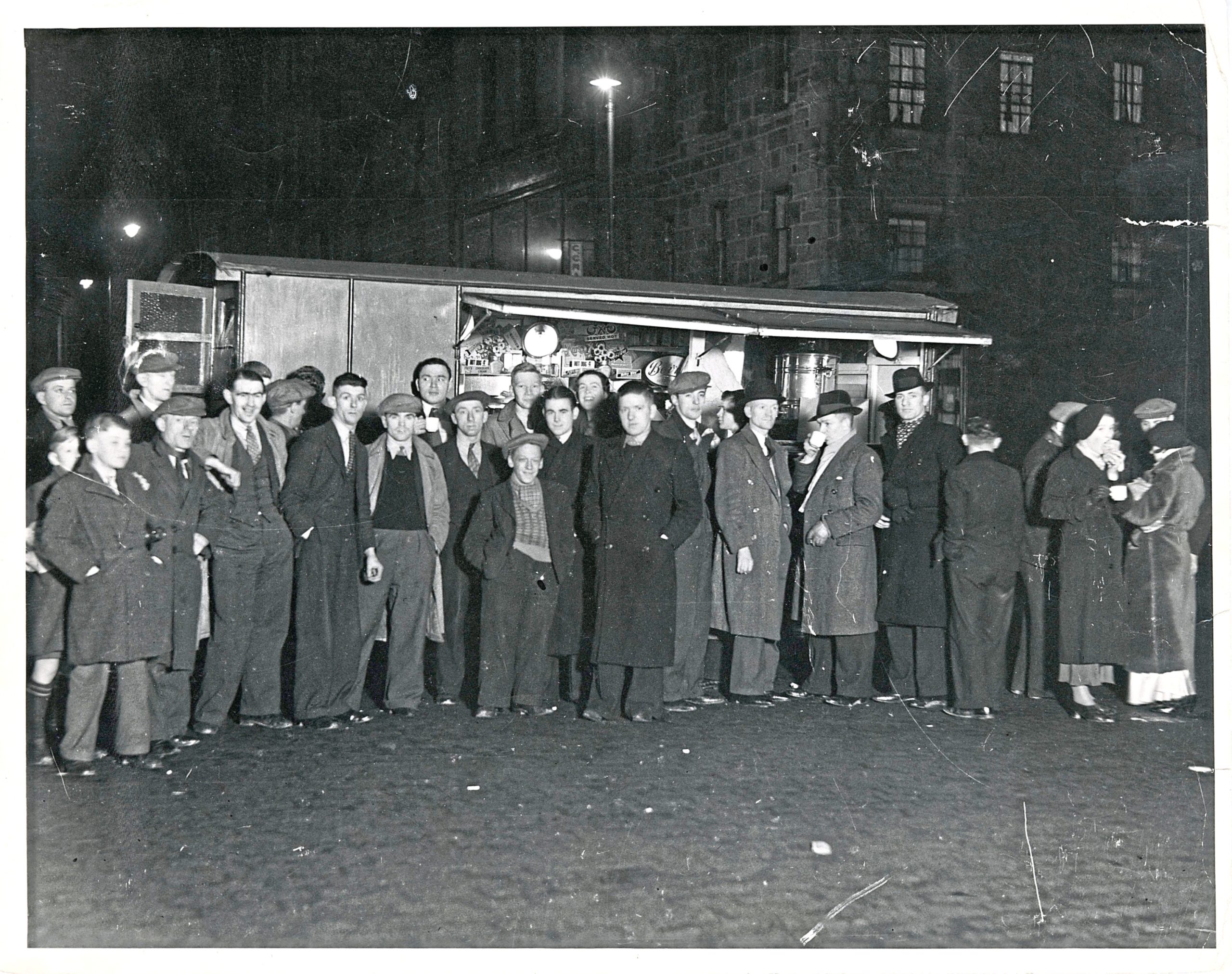 Shift workers and late night revellers at the coffee stall on the Castlegate in 1938.