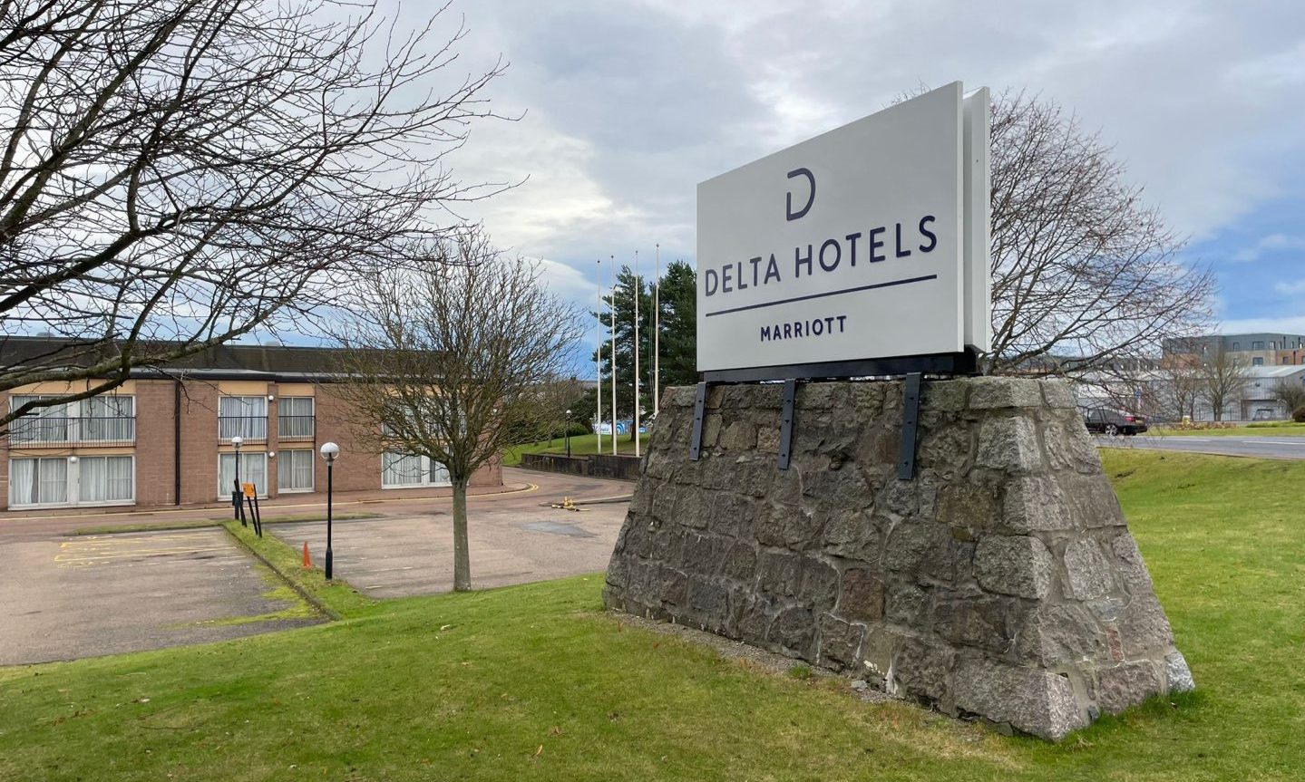 The sign outside the hotel that reads 'Delta hotels | Marriott'