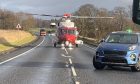 Air ambulance on the A9 near Invergordon.