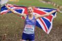 Great Britain's Megan Keith celebrates after crossing the finish line to take first place in the Women's Under 23 race during the European Cross Country Championships in Brussels. Image: PA