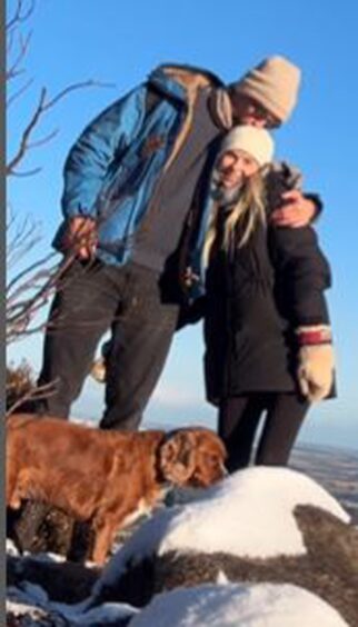 James Watt and Georgia Toffolo with their dog on a wintry walk in Aberdeenshire.