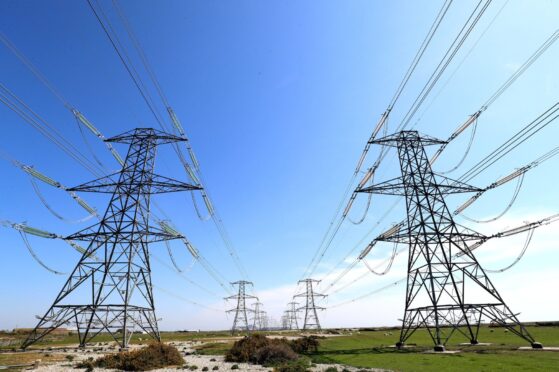 Pylons running through field.