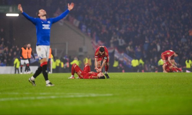 Agony and ecstasy at the full-time whistle as Aberdeen are beaten by Rangers. Image: Darrell Benns/DC Thomson