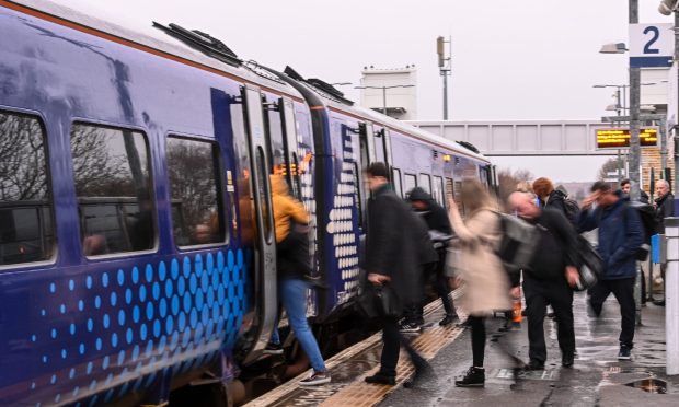 Passengers boarding a train at Dyce. Image: Darrell Benns/DC Thomson