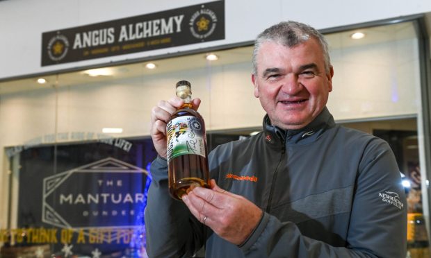 Golfing legend Paul Lawrie stopped by one of the Trinity Centre bottle shops for a signing session.