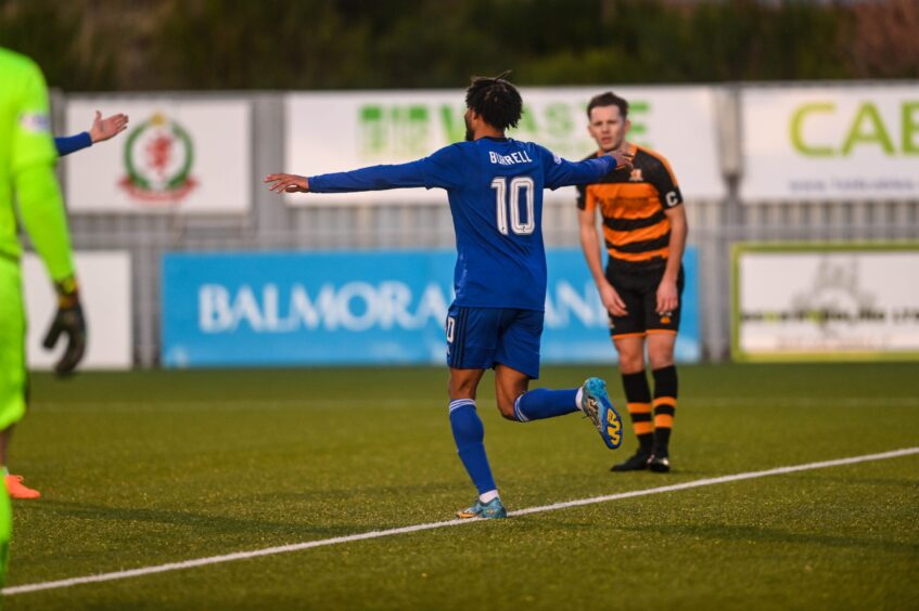 Rumarn Burrell celebrating after scoring a goal for Cove Rangers against Alloa Athletic.