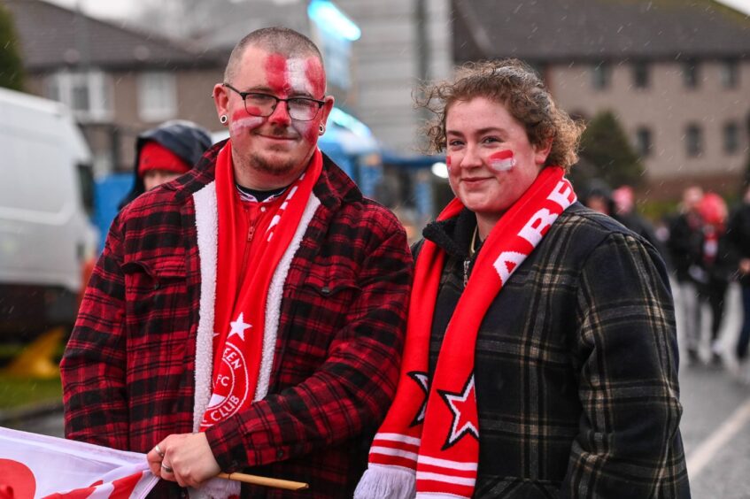 Aberdeen fans with Dons face paint ahead of Viaplay Cup final against Rangers at Hampden Park.