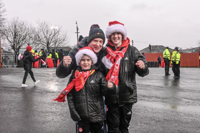 Dons fans with Santa hats on.