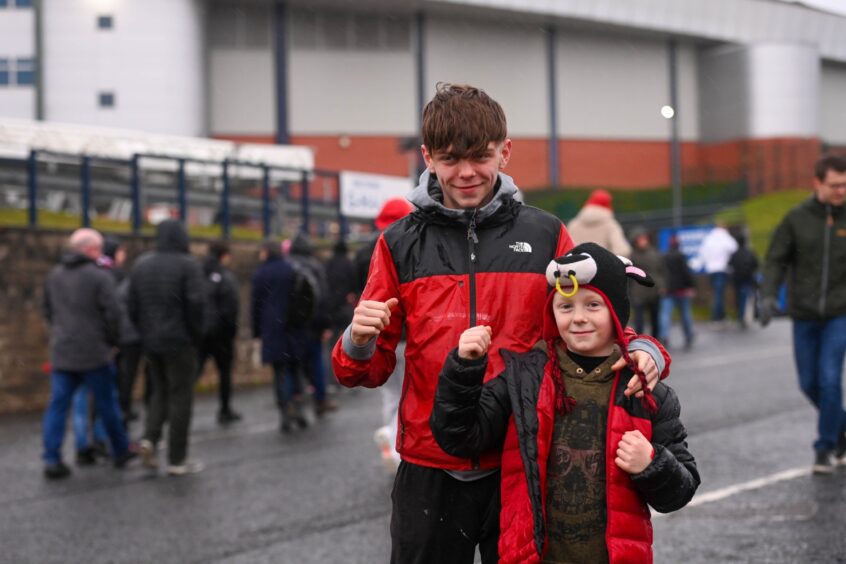 Young Aberdeen fans cheer on Dons ahead of game at Hampden.