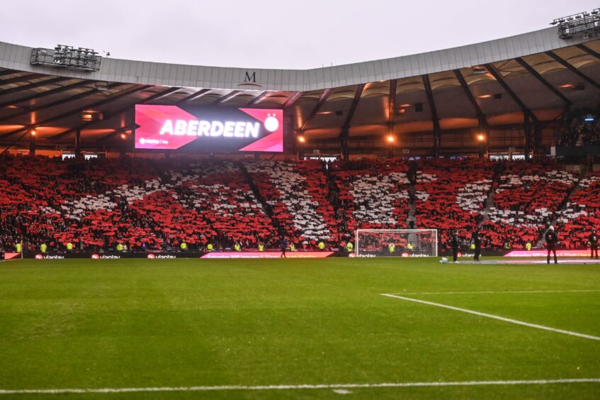 View of crowds of Aberdeen fans at Hampden Park.
