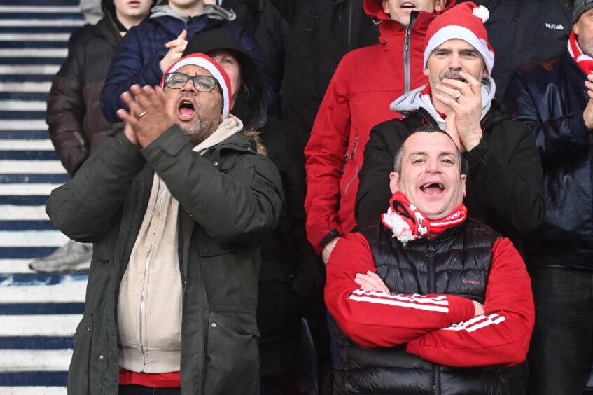 Aberdeen supporters cheering.