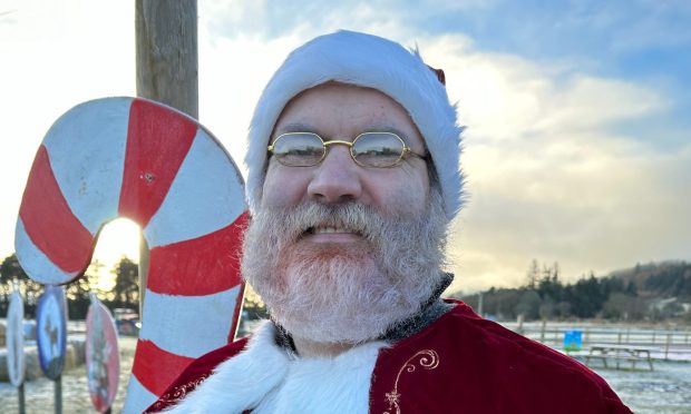 Santa Claus (Donald Fraser) has been spotted at Farmer Christmas. Image: Farm Ness
