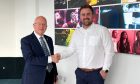 Graeme Munro & Ross Murray completing the acquisition. Image: Instinct Marketing
