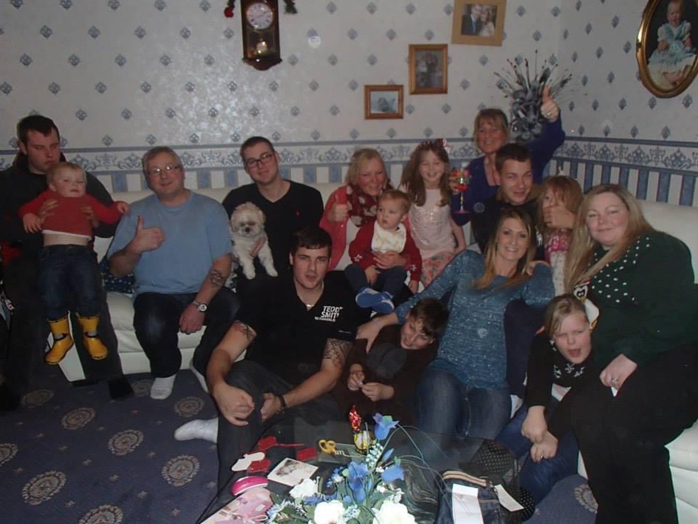 A group photo of Tommy with his extended family.
