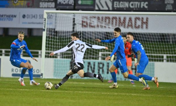 Elgin City's Ryan McLeman pictured scoring against Peterhead in a League Two match at Borough Briggs.