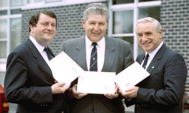 Jack Whitehead, left, with Jim McPherson and Charlie Grant after the trio were honoured with life memberships of the SJFA for their services to junior football in 1991. Image: DC Thomson