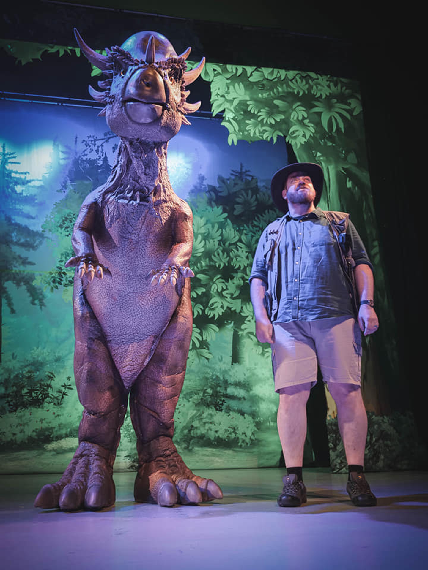 Ranger with dinosaur on stage for Jurassic Live. 