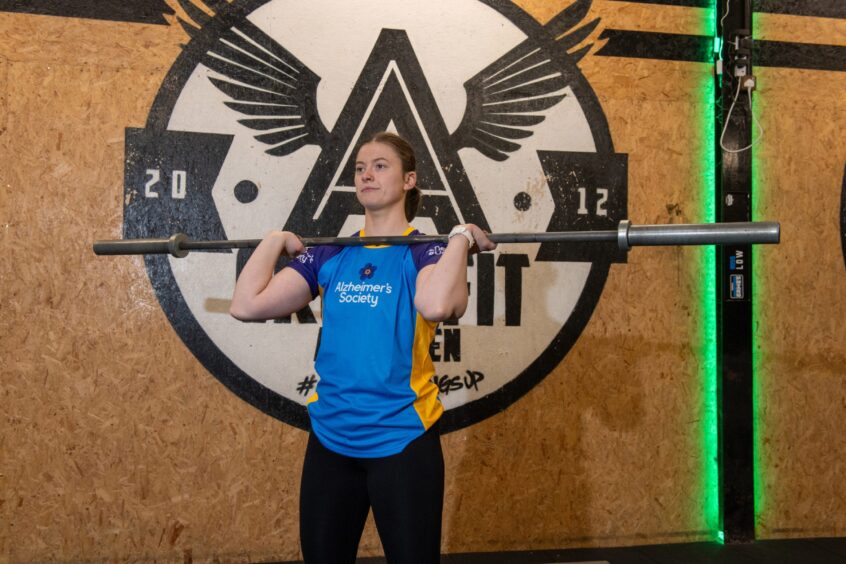26-year-old Aine Gillespie holds a barbell as she gets ready for her CrossFit challenge in Aberdeen