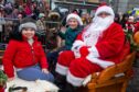 Youngsters with Santa and the reindeer. Image: Kenny Elrick/DC Thomson