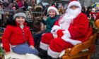 Youngsters with Santa and the reindeer. Image: Kenny Elrick/DC Thomson