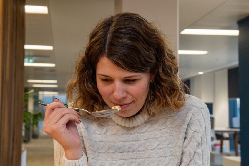 P&J reporter Alex, smelling a portion on a spoon