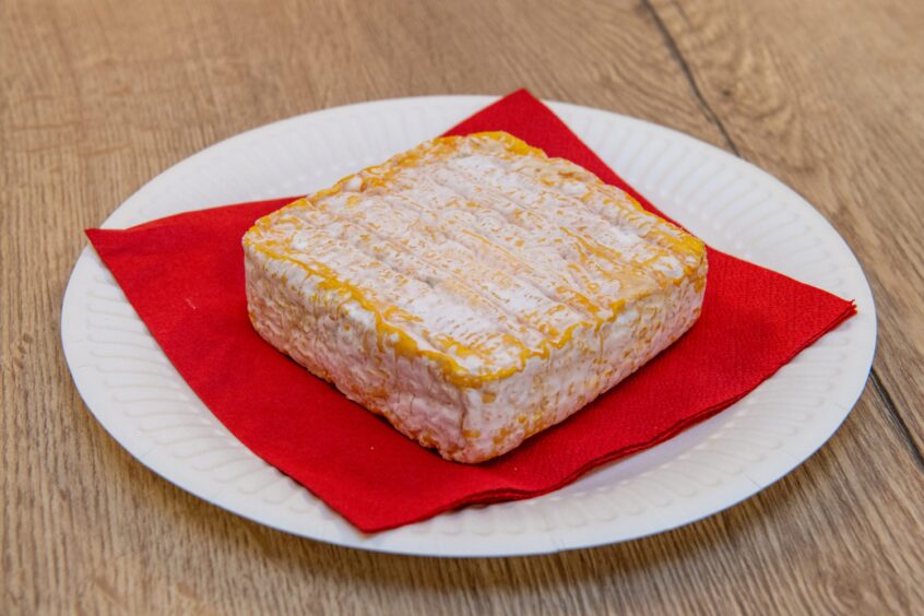 A block of Minger cheese on a plate
