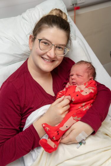 Maja Shearer holding baby Eliza.