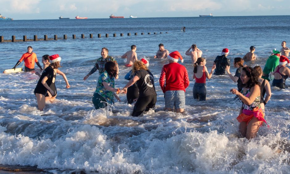 People having fun in the water at Aberdeen beach on Boxing Day.