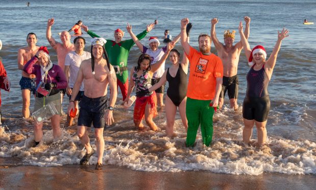 Hundreds of brave participants plunged into the North Sea waters at Aberdeen Beach for this year's Boxing Day Nippy Dip Image: Kenny Elrick/DC Thomson