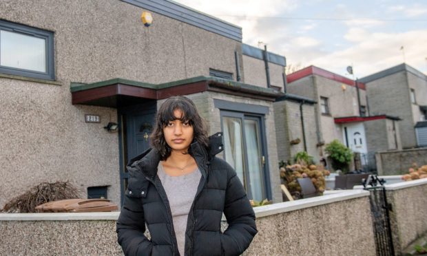 Hannah Chowdhry, an aberdeen student standing outside her home in Torry.
