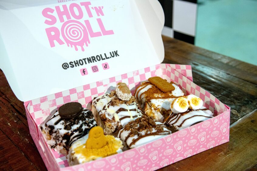 A selection of Shot 'n' Roll cinnamon rolls including Oreo and Biscoff flavours