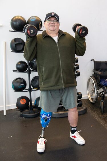 Amputee Atholl Smart lifts some weights in Aberdeen Sports Village's gym
