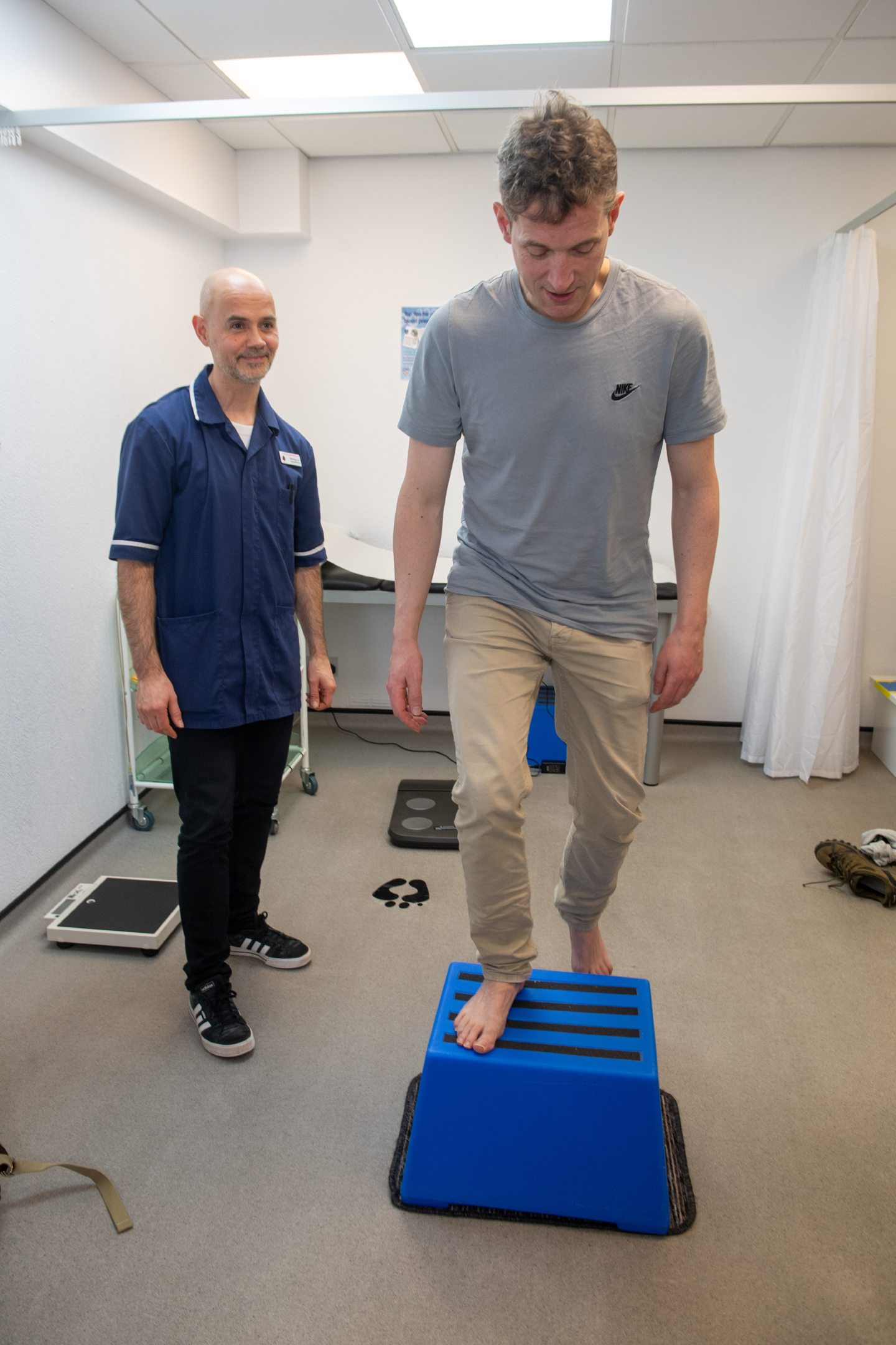 Andy Morton tackles the step test as IMM nurse David Macleod looks on