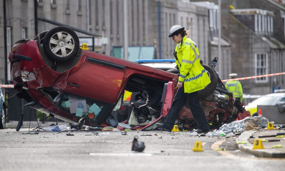 A police officer at the scene of the Crown Street crash