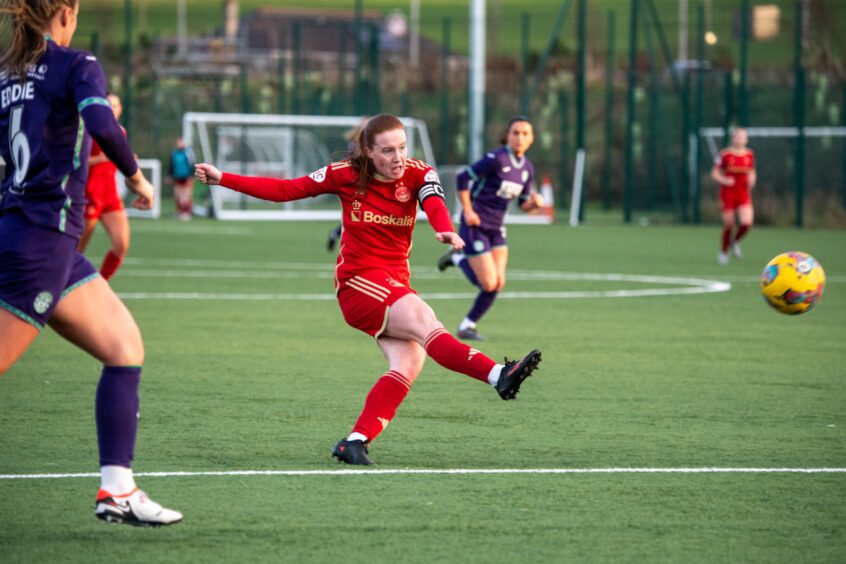 Aberdeen FC Women forward Hannah Stewart unleashes a shot in a SWPL match against Hibernian.