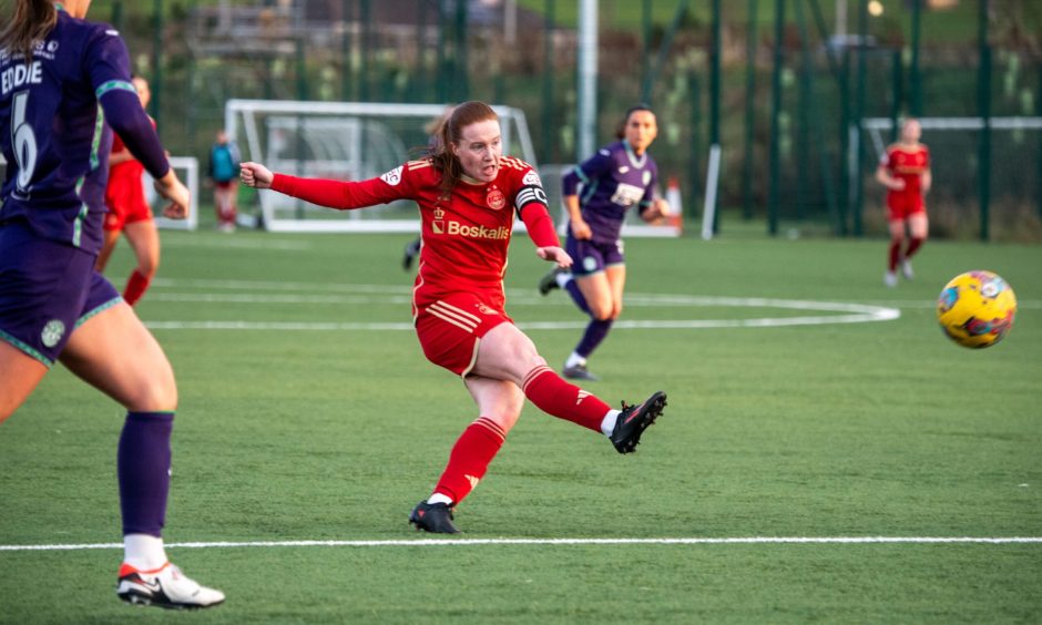 Aberdeen FC Women captain and forward Hannah Stewart unleashes a shot in a SWPL match against Hibernian.