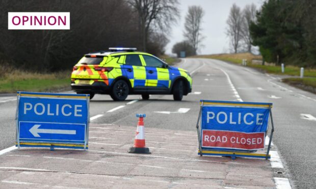 A police road closure after a traffic accident on the A9 between Delny and Tomich. Image: Sandy McCook/DC Thomson
