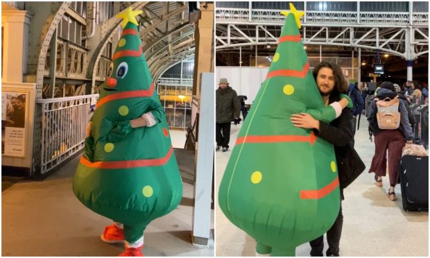 Jennifer Morrison greeted her son Aidan, 19, at Aberdeen train station wearing an inflatable Christmas tree costume. Image: Jennifer Morrison