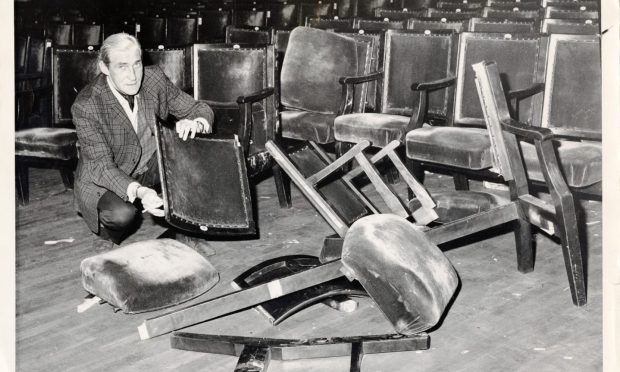 Hallkeeper Ted Burnett surveys the damage in the Music Hall after the Status Quo concert in 1973. Image: DC Thomson