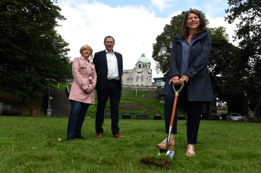 The council administration leaders - Jenny Laing, Douglas Lumsden and Marie Boulton - cut the turf in August 2019 as work on the Union Terrace Gardens revamp begins. Image: Kenny Elrick/DC Thomson