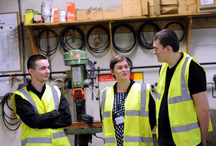 Aberdeen City Council chief executive Angela Scott meets young people on a work scheme in 2014. Image: Kami Thomson/DC Thomson