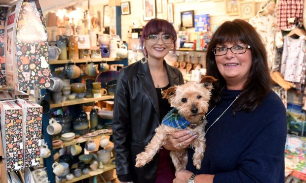 Marnie Mackenzie, who believes the Victorian Market is becoming a "community hub", with her daughter Sarah and their pet Charlie. Image: Sandy McCook/DC Thomson