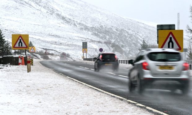 Chtristmas traffic on the A9 at Slochd summit between Caeebridge and Tomatic after the overnight falls of snow.Traffic further north however weren't so liucky with heavdy snow affecting roads in the Helmsdale area