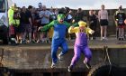 The annual Burghead harbour swim took place on boxing day with 57 swimmers taking part swimming across the harbour entrance. All Images: Sandy McCook/DC Thomson