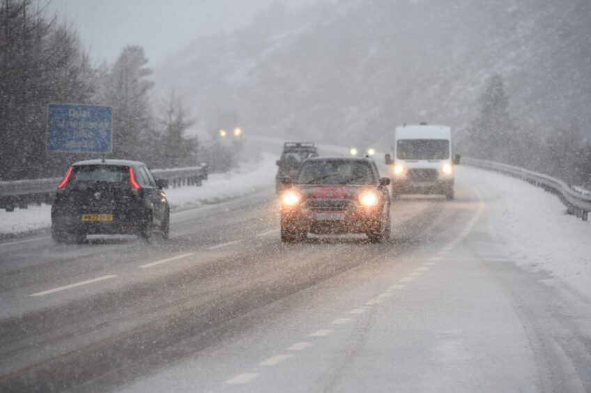 Vehicles travelling through snow on the A9