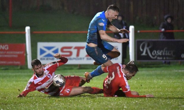 Peterhead's Rory McAllister is stopped by the Bonnyrigg Rose defence. Image: Duncan Brown.