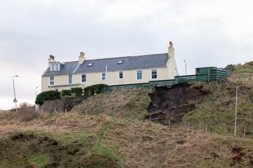 Landslip on hill near house in Pennan due to Storm Gerrit.